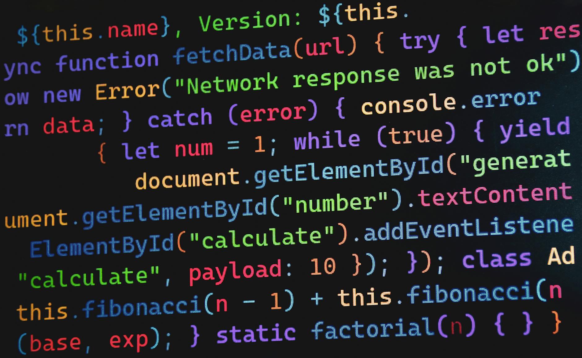 Kolorowy kod JavaScript na monitorze symbolizujący programowanie i G-code